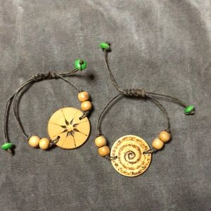 Handmade wood & waxed cord bracelets, wood burned designs. Made by me.